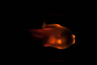 Illustration for article titled A Squirt of Flame Forms a Fiery Jellyfish in Microgravity